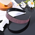 Pink rhinestone headband with black base displayed on a decorative reflective surface - Purple Full Rhinestone Solid