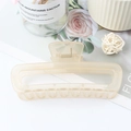 Minimalist beige leopard print hollow hair claw clip on a decorative white setting - Jelly Beige