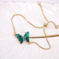 Detail of adjustable gold butterfly bracelet with dark green crystals and zircon accents - Dark Green