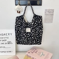 Detail of floral canvas tote bag with black heart leopard print and striped handle straps - Corduroy Leopard Heart Black