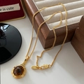 Elegant gold necklace with oval smoky quartz pendant on premium jewelry display - Smoky Quartz Necklace XL0225