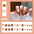 Detail view of R710 press-on nails with cute hand-painted rabbits and amber color - R710 Lucky Rabbit