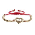 Adjustable red string bracelet featuring a gold heart pendant with cubic zirconia stones - Gold Beads Red Rope