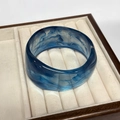 Irregular resin bangle in smoky marble blue finish displayed in a velvet jewelry box - Inner Diameter 67.2mm / Weight 67g / Ocean Blue