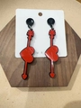 Detailed view of red acrylic heart and arrow earrings on a white display card - Heart with Arrow