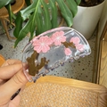 Detailed close-up of a clear acetate hair claw clip featuring pink cherry blossom patterns - Cherry Blossom Transparent Semi-Circle Claw
