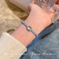 Light blue beaded bracelet with oval centerpiece stone in a retro silver-tone setting - Retro Blue Beaded Charm Bracelet