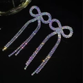 Sparkling AB rhinestone bow earrings with long tassels in a polished silver finish - Stud Earrings / Silver AB Color