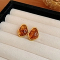 Close-up of irregular amber studs with gold trim inside a beige velvet jewelry box - Gold-Edged Irregular Stud Earrings (29# Silver Earring Post - Gold - Coffee - Curved)