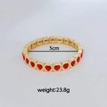 Vergulde elastische armband met rode hartvormige stenen, totaalgewicht van 23,8 gram - Rood Hart