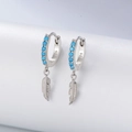 Detailed close-up of S925 silver feather earrings with blue turquoise gemstone inlay - Silver