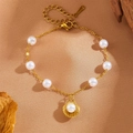 Golden stainless steel chain bracelet with white pearls and a seashell charm pendant - Pearl Shell Charm Bracelet