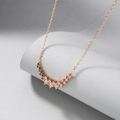 Close-up of curved gold necklace with vibrant multi-colored cubic zirconia gemstones - Yellow Gold - Multicolor Zirconia (Style 1)