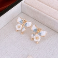 Macro detail of butterfly crystal stud earrings with white flower in a jewelry box - Patchwork Butterfly Five-Petal Flower Earrings