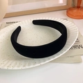 Close-up of a thick black velvet headband displayed on a ceramic tray for a French vintage look - Black