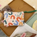 Compact quilted floral coin purse with colorful geometric print and green cord zipper - Colorful U-Pattern