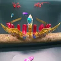 Detailed shot of handmade crystal crown headband with golden wings on dark wood branch - Red Blue Crystal + Gold Wings