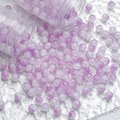 Close-up of 10mm purple and white gradient glass beads spilling from clear tubes - 10mm / Purple White