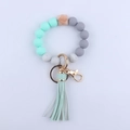 Silicone bead keychain bracelet in mint and grey with faux leather tassel and gold ring - Green