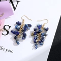 Detail of bohemian drop earrings featuring natural blue crystal stones and gold hooks - Gold Hook Style / Blue Chip Stone