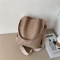 Brown crocodile embossed bucket bag with wide woven strap and gold hardware accents - Khaki