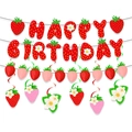 Flat lay of strawberry theme Happy Birthday banner with matching flower party pendants - Strawberry Banner Garland and Hanging Swirls Set