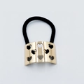 Black elastic hair tie with a curved gold alloy plate featuring hollow heart patterns - Hollow Heart Metal Hair Tie (64)