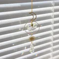 Star and moon suncatcher with heart-shaped crystal prism in a gold finish hanging pendant - Size 26