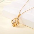 Gold stainless steel necklace with rotating windmill pendant featuring five white pearls - Rotating Windmill Pearl Style (137525)