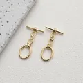 Macro shot of 14K gold plated OT toggle clasps for DIY jewelry making on stone background - Style F Oval Link / 14K Gold