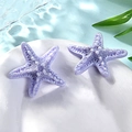 Two small purple resin starfish ornaments for DIY crafts on a white plate background - Small / Light Purple