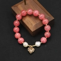 Pink quartz bead bracelet with two white baroque pearls and golden hollow heart pendant - Watermelon Red Hollow Heart Elastic Freshwater Pearl Bracelet