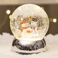 Christmas snow globe with cute snowmen figurines and a shiny silver mirrored base - Silver Base Three Snowmen Style