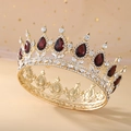Detailed close-up of golden Baroque crown with clear crystals and red teardrop gems - Gold Base + Wine Red
