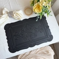 Black rectangular vintage leather placemat with embossed floral patterns and wavy edges - Embossed Totem Black