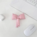 Close-up of a handmade pink fabric bow charm accessory on a minimalist white desk setup - Pink Solid Bowknot Accessory