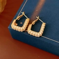 Macro shot of gold square hoop earrings with pave-set clear zircon on blue box - Gold Plated Copper (With 925 Silver Pin) / Gold