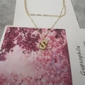 Double-layered gold necklace with paperclip chain and textured letter S pendant - S