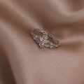 Macro shot of silver ring with yellow pear-cut gemstone and floral diamond details - Pink Three-Petal Flower (Silver) (21701C)
