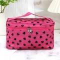 Pink rectangular cosmetic bag with black heart patterns and handle on marble surface - Rose Red Black Heart