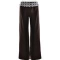 Detailed view of dark brown straight leg trousers featuring a grey polka dot fold-over waistband - S / Coffee