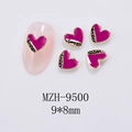 Macro detail of MZH-9500 pink enamel heart nail charms with sweet gold engraving - Heart Gold Rose Red Style (9500)