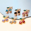 Detailed view of cherry pendants with colorful stones and gold-plated metal finish - Style 31