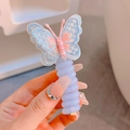 Cute lavender spiral hair tie with a pink and blue embroidered butterfly detail - Blue Butterfly/Pale Purple Loop