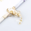 Miniature koi fish ornament made of clear resin with white and gold crystal stone flakes - White Shell