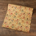 Colorful cartoon birthday wrapping paper with cupcakes on brown kraft paper background - Musical Note Cake