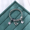 Silver steel wire bangle with pink enamel starfish, bee and butterfly charms - Bee Butterfly Two-tone Flower Charms / Black