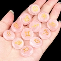 Pink rose quartz zodiac stones set with gold engraved signs held in a hand - Rose Quartz (12 Pcs)