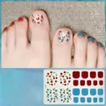Macro detail of H134 floral 3D toe nail stickers with red and blue rose patterns - H134 Red Cherry / Blue Flower