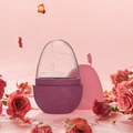 Detailed view of the rose petal ice facial roller in a soft pink creative setting - New Egg Shape - Rose Red